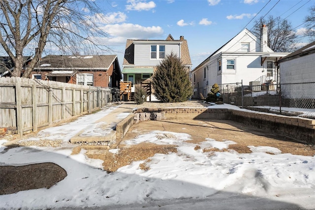 view of snow covered property