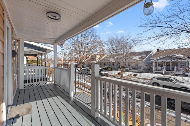 wooden terrace featuring a residential view