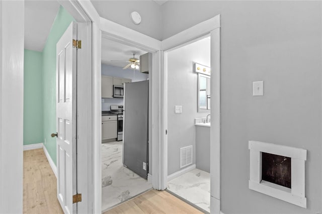 bathroom with vanity and ceiling fan