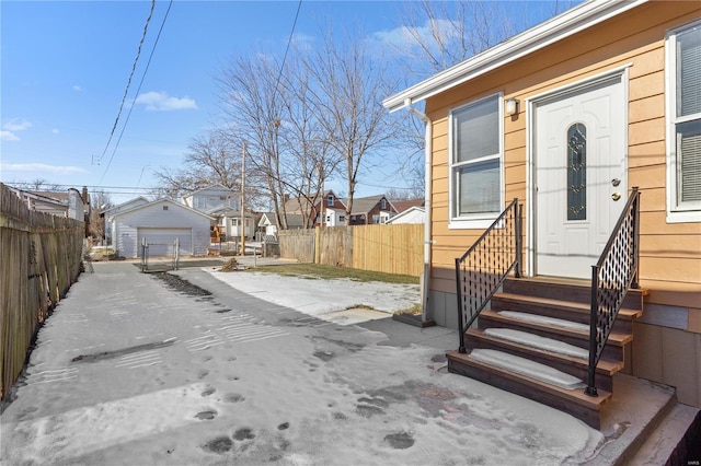 exterior space with an outbuilding and a garage