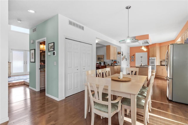 dining room with dark wood-type flooring