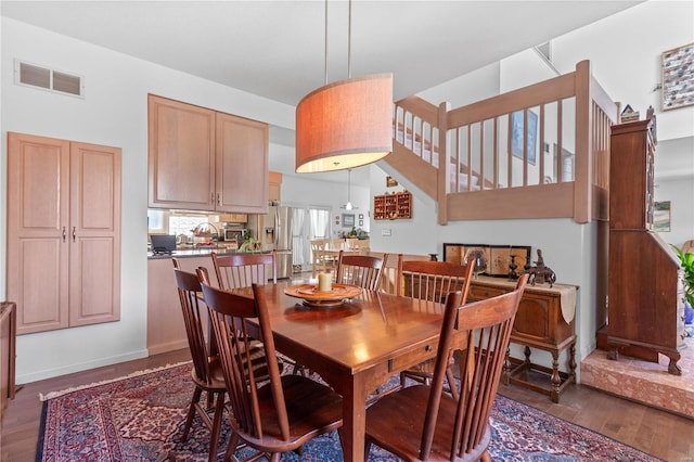 dining room with dark hardwood / wood-style floors