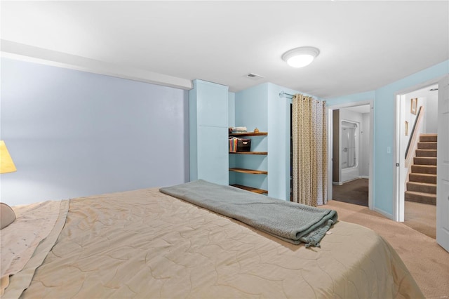 bedroom featuring light colored carpet