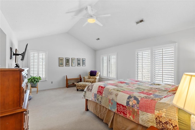 bedroom featuring multiple windows, light colored carpet, ceiling fan, and lofted ceiling