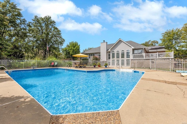 view of swimming pool featuring a patio area