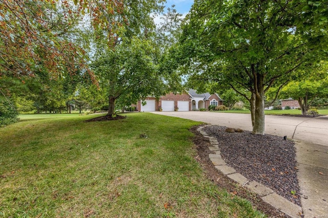 view of front of home with a garage and a front yard