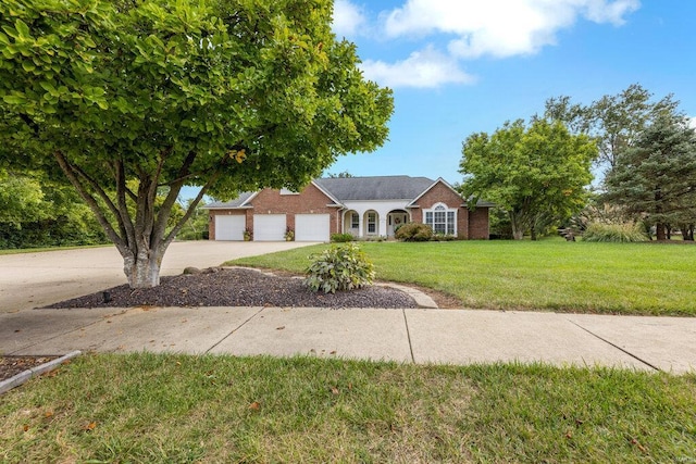 ranch-style house with a garage and a front lawn