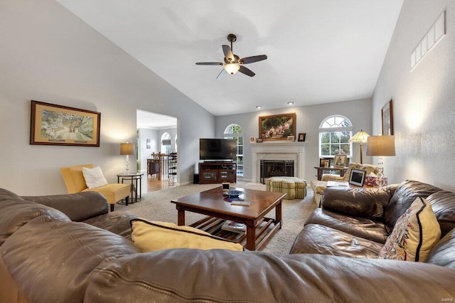 living room with ceiling fan, carpet, and high vaulted ceiling