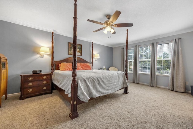 carpeted bedroom with crown molding and ceiling fan