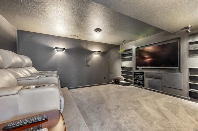 cinema featuring carpet floors and a textured ceiling