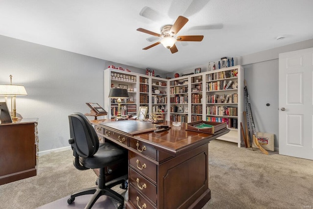 home office with light colored carpet and ceiling fan