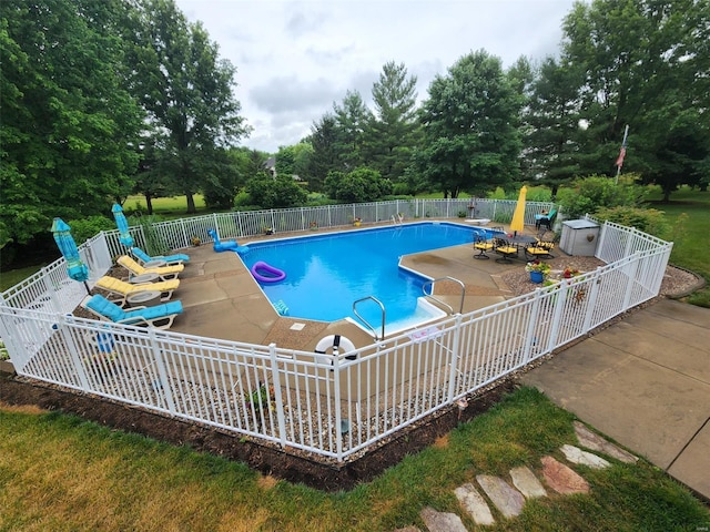 view of pool featuring a patio