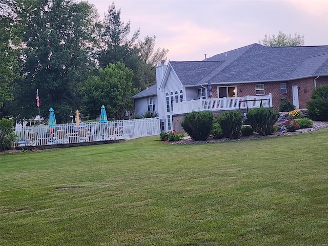 yard at dusk with a swimming pool