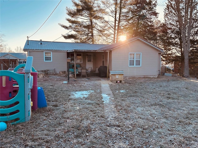 view of back house at dusk