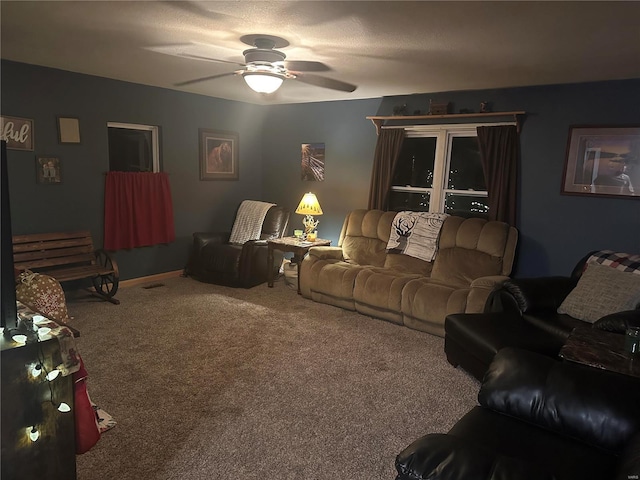 carpeted living room featuring ceiling fan