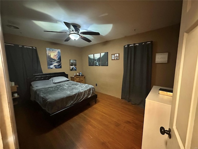 bedroom featuring hardwood / wood-style flooring and ceiling fan