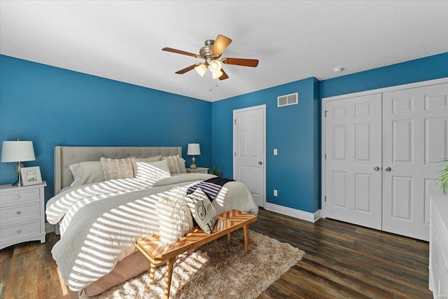 bedroom with ceiling fan and dark hardwood / wood-style floors