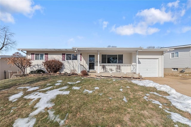 ranch-style home with a garage, a front yard, and covered porch