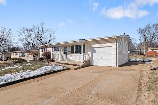 ranch-style house with a garage and covered porch