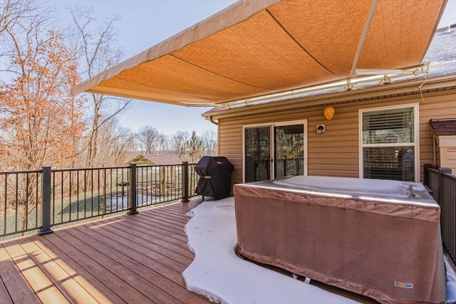 wooden terrace featuring grilling area and a hot tub