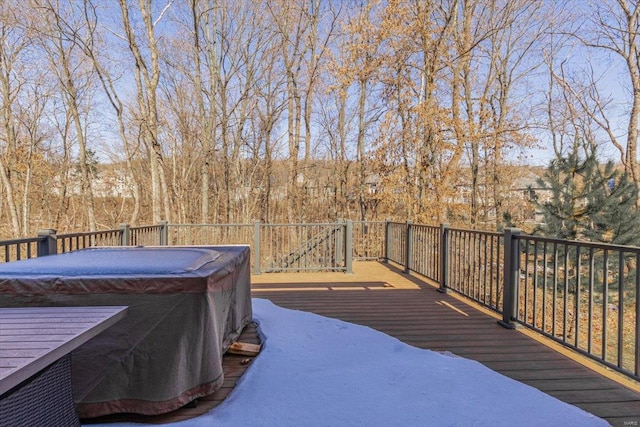 deck featuring a hot tub