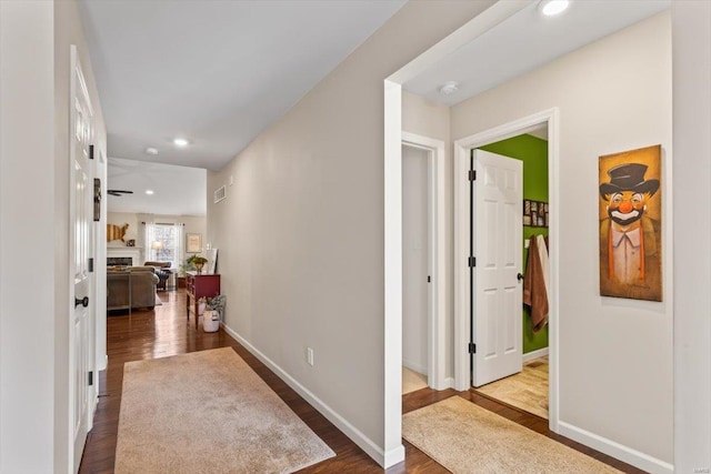 corridor with wood-type flooring