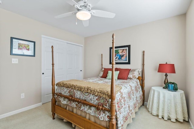 carpeted bedroom with a closet and ceiling fan