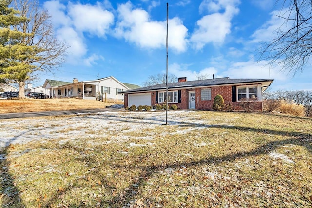 back of property featuring a garage