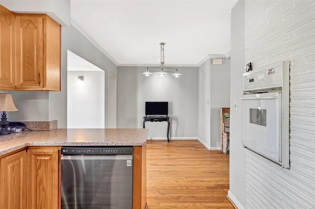 kitchen featuring crown molding, dishwasher, light hardwood / wood-style flooring, and oven