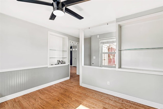 unfurnished room with ceiling fan and light hardwood / wood-style flooring