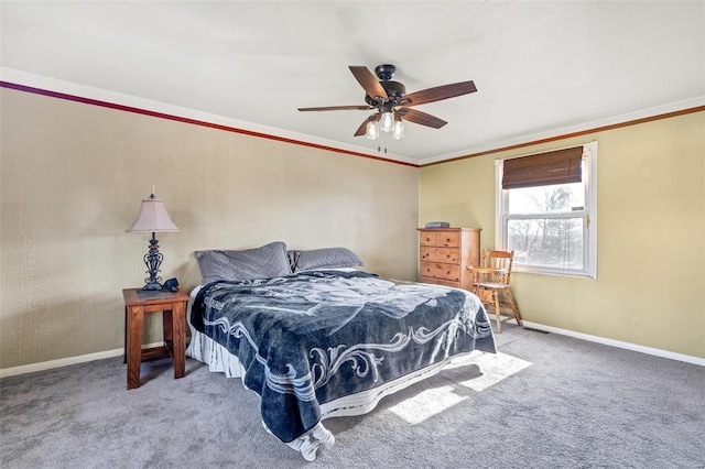 bedroom with crown molding, carpet flooring, and ceiling fan