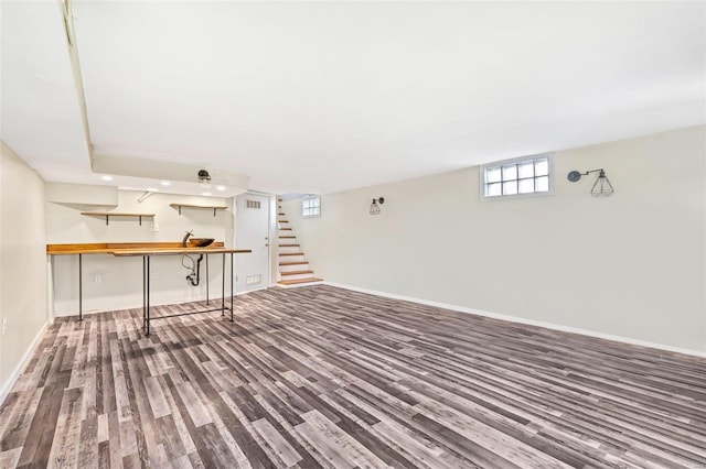 basement with hardwood / wood-style floors