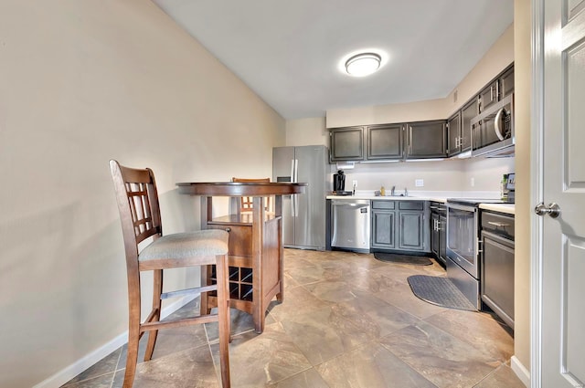 kitchen with sink and appliances with stainless steel finishes