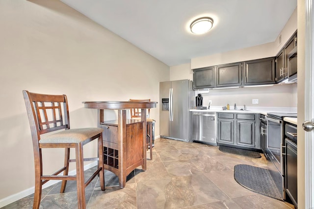 kitchen with sink and appliances with stainless steel finishes