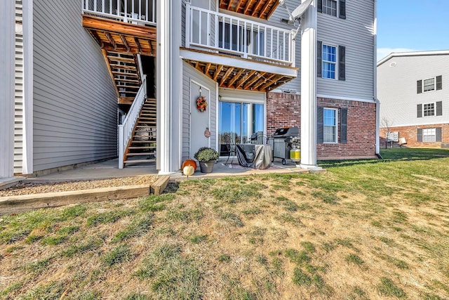 back of property with a patio area and a lawn