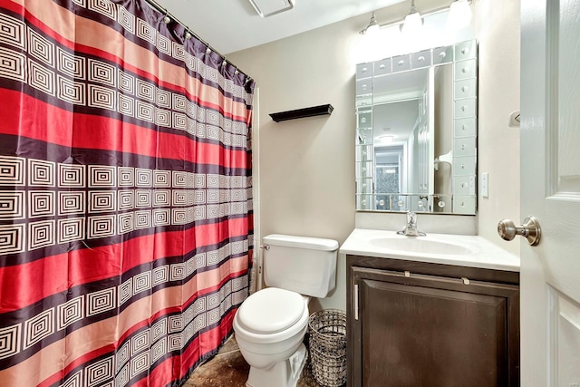 bathroom with vanity, toilet, and curtained shower