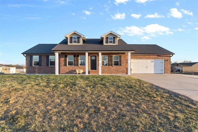 cape cod-style house with a porch, a garage, and a front lawn