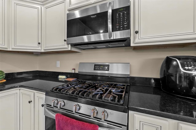 kitchen with white cabinetry and stainless steel appliances