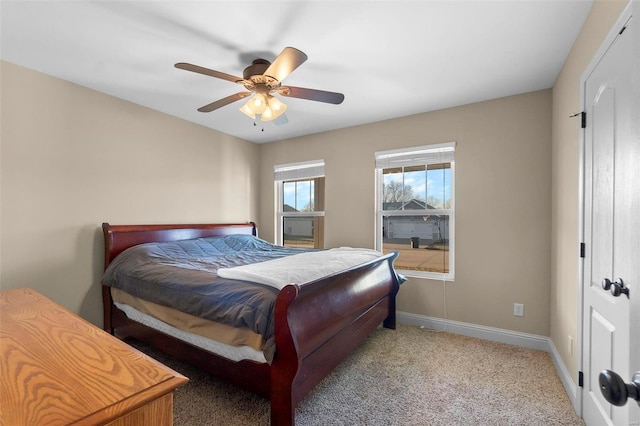 bedroom featuring ceiling fan and light colored carpet