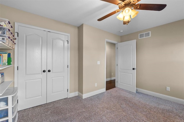 unfurnished bedroom with a closet, ceiling fan, and carpet