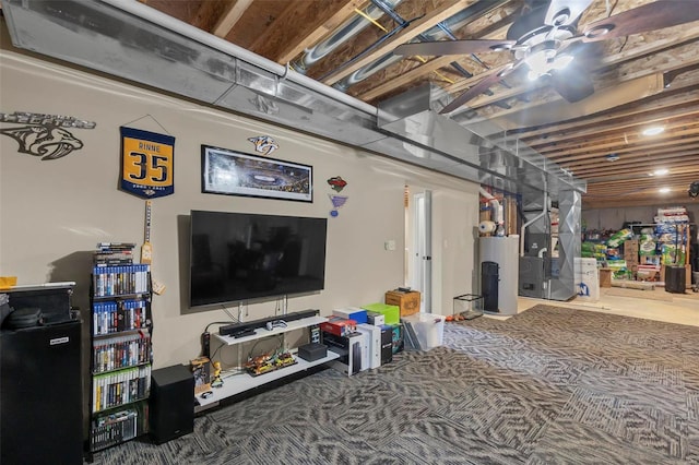 basement with heating unit, water heater, ceiling fan, and carpet flooring