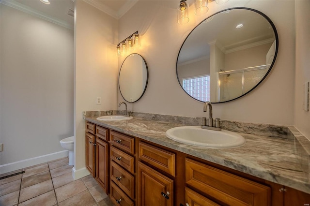 bathroom featuring crown molding, a shower with shower door, vanity, and toilet