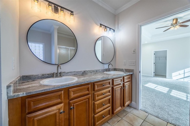 bathroom featuring crown molding, tile patterned floors, ceiling fan, and vanity