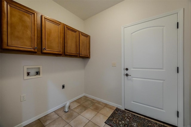 laundry area with cabinets, light tile patterned floors, hookup for a washing machine, and electric dryer hookup