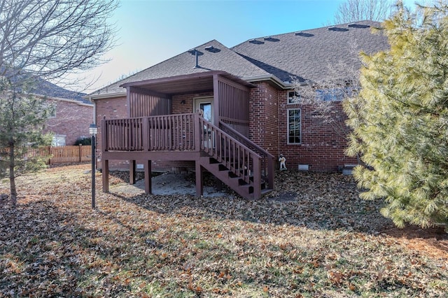 back of house with a wooden deck