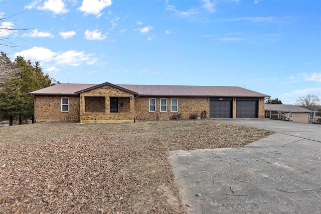 ranch-style home featuring a garage