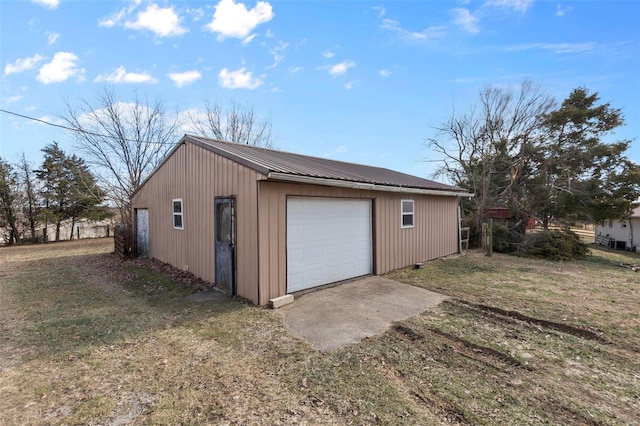 garage featuring a lawn