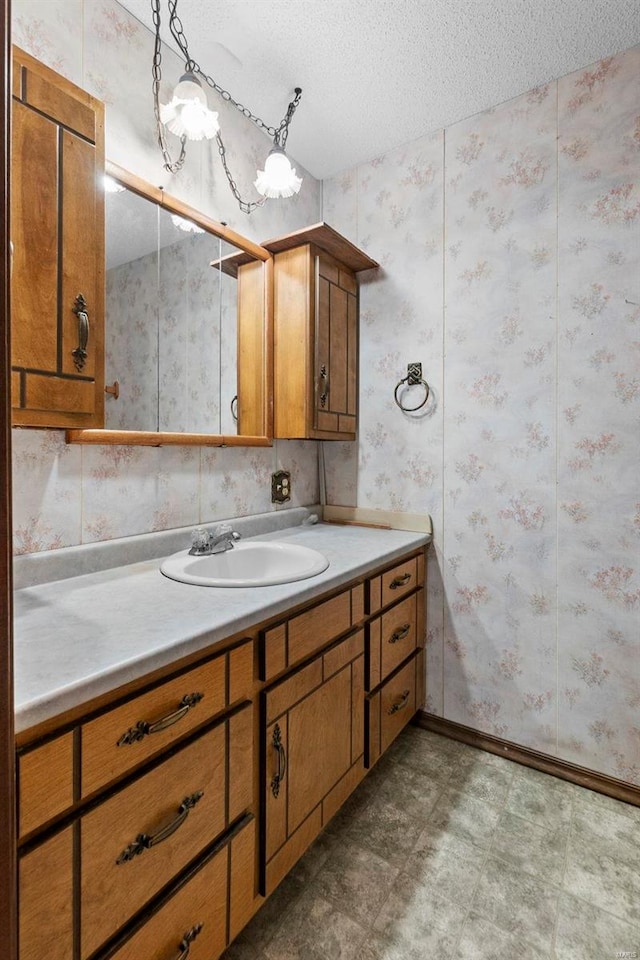 bathroom featuring vanity and a textured ceiling