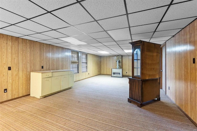 bar featuring light carpet and wooden walls