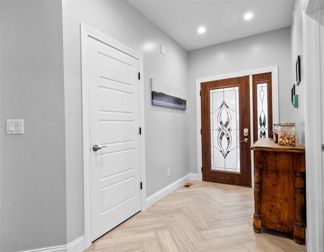 entrance foyer with light parquet flooring